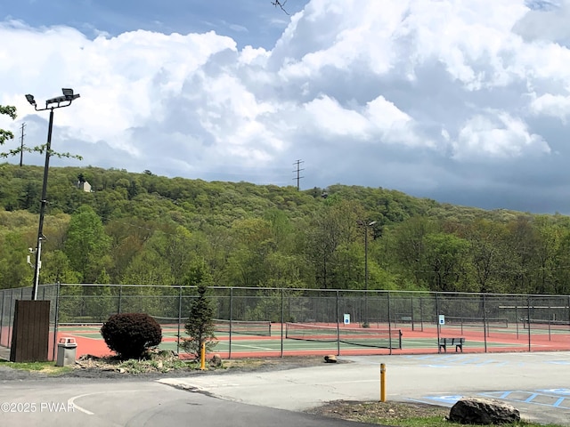 504 St Ives Ct, Bushkill, PA 18324 - view of tennis court with a view of trees