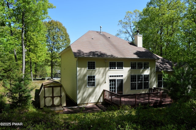 504 St Ives Ct, Bushkill, PA 18324 - back of house featuring a deck, a chimney, and a shingled roof