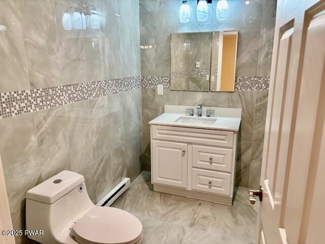 9 Wallenpaupack Dr, Lake Ariel, PA 18436 - bathroom featuring a baseboard radiator, tile walls, vanity, and marble finish floors