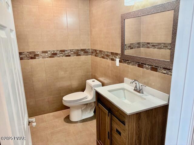 9 Wallenpaupack Dr, Lake Ariel, PA 18436 - half bathroom featuring vanity, tile patterned flooring, and tile walls