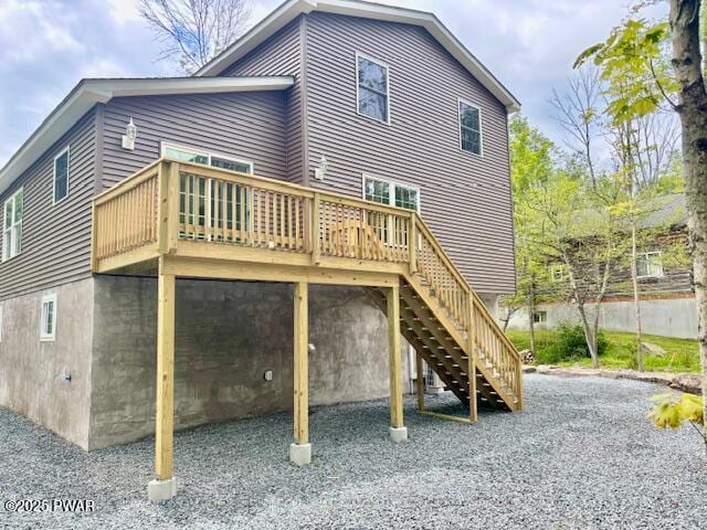9 Wallenpaupack Dr, Lake Ariel, PA 18436 - back of property featuring a deck, a carport, and stairs