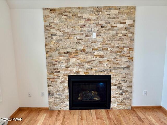 9 Wallenpaupack Dr, Lake Ariel, PA 18436 - detailed view of wood finished floors and a fireplace