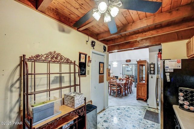 kitchen with ceiling fan, stainless steel fridge, beam ceiling, and wooden ceiling