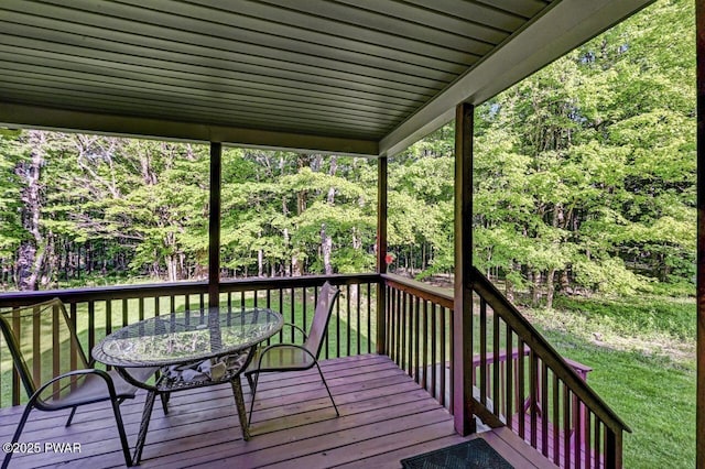 32 Forest Ln, Lake Ariel, PA 18436 - wooden deck featuring a yard, outdoor dining space, and a view of trees