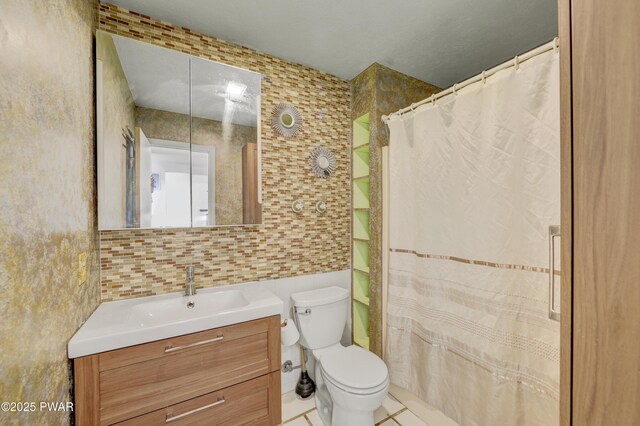 101 Bayberry Dr, Milford, PA 18337 - full bathroom featuring tile walls, vanity, toilet, tile patterned floors, and decorative backsplash