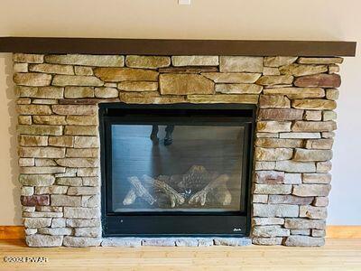 details with a stone fireplace