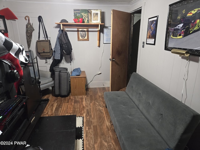 interior space featuring ornamental molding and dark wood-type flooring