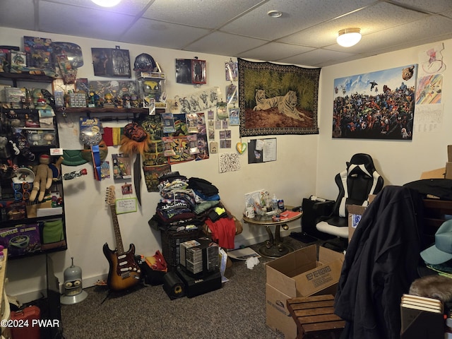 home office with a paneled ceiling and carpet floors