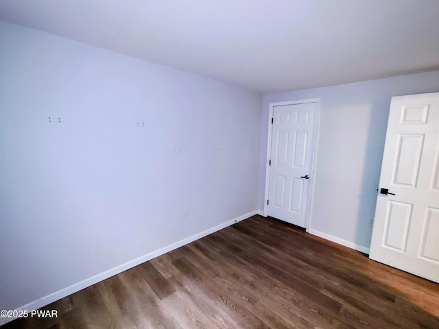 104 Radcliff Rd, Bushkill, PA 18324 - unfurnished bedroom with dark wood-type flooring and baseboards