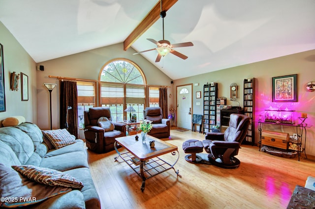 1419 Bear Dr, Bushkill, PA 18324 - living area featuring wood finished floors, ceiling fan, beamed ceiling, and high vaulted ceiling
