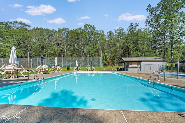 1419 Bear Dr, Bushkill, PA 18324 - community pool featuring a patio and view of wooded area