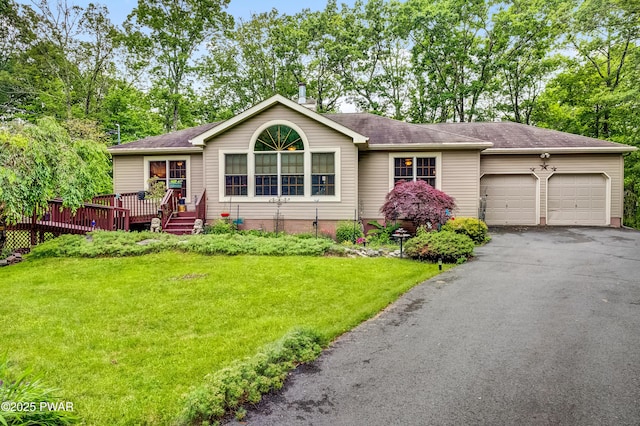 1419 Bear Dr, Bushkill, PA 18324 - single story home featuring an attached garage, a front yard, driveway, a wooden deck, and roof with shingles