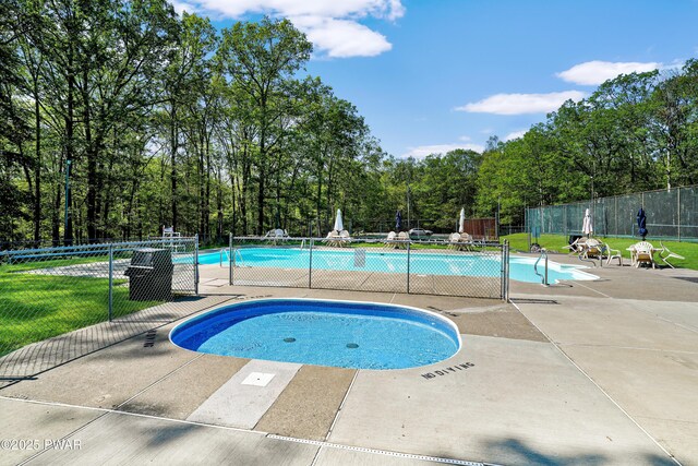 1419 Bear Dr, Bushkill, PA 18324 - community pool with a patio area and view of scattered trees