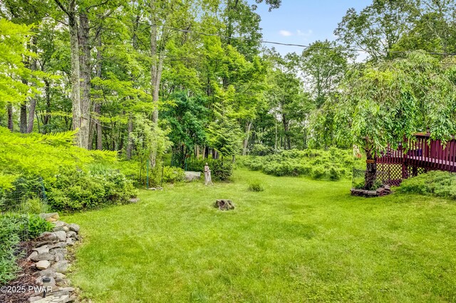 1419 Bear Dr, Bushkill, PA 18324 - view of grassy yard featuring a wooden deck