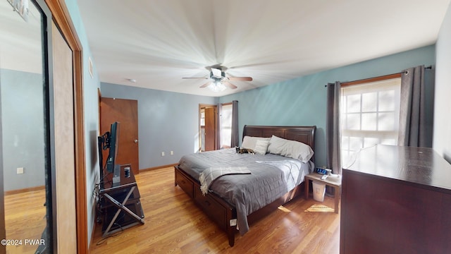 bedroom featuring light hardwood / wood-style flooring and ceiling fan