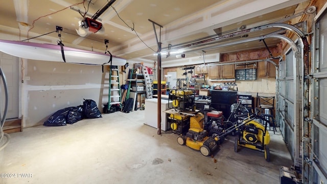 garage with a workshop area and a garage door opener