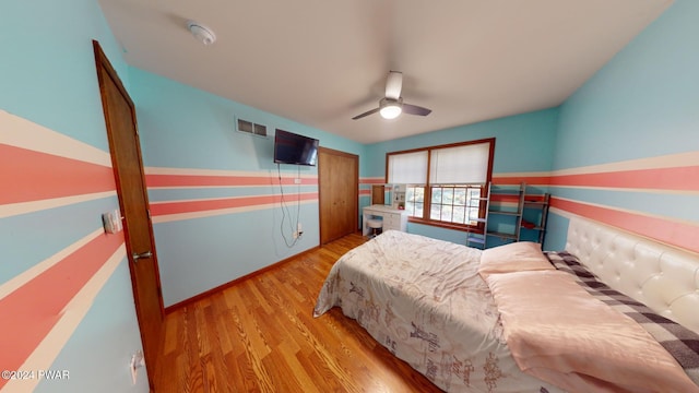 bedroom featuring light hardwood / wood-style flooring and ceiling fan