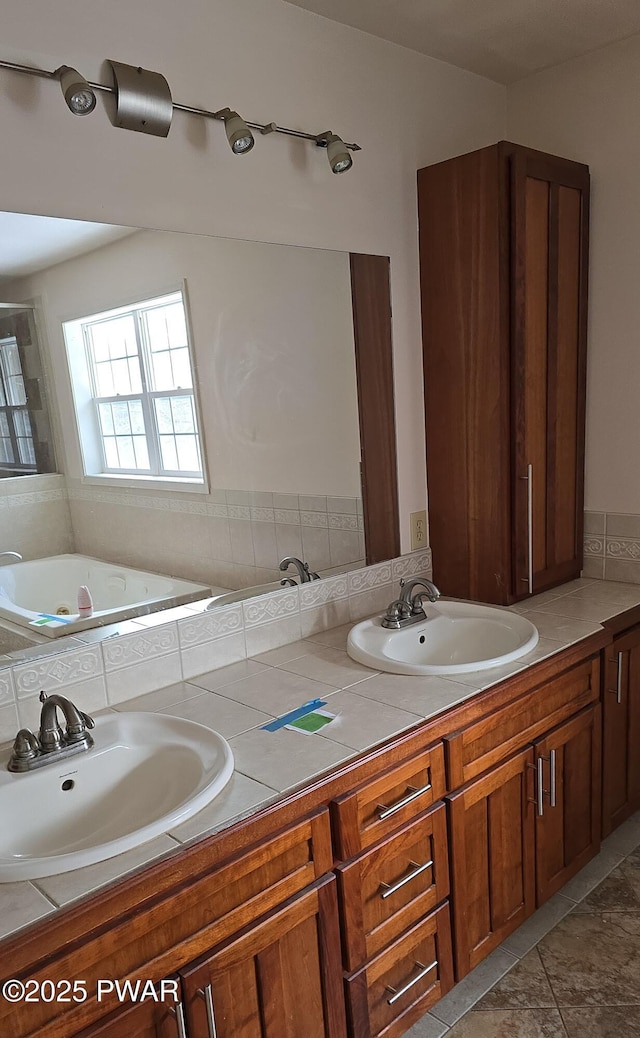 bathroom featuring tile patterned flooring, a sink, and double vanity