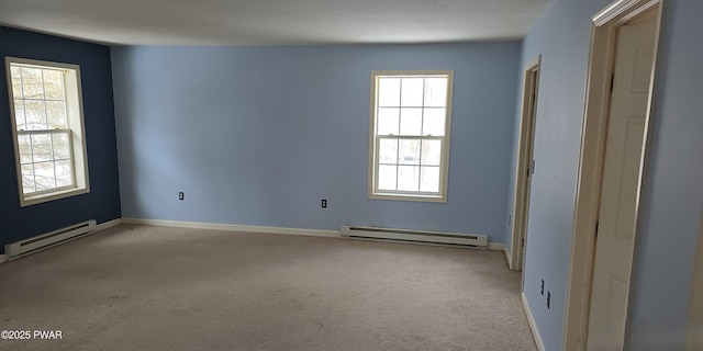 empty room with light carpet, a baseboard radiator, and baseboards