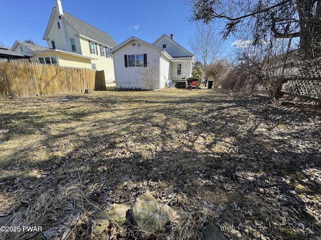 back of property featuring fence