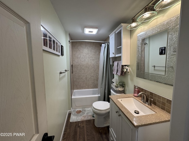 bathroom with tasteful backsplash, toilet, shower / bath combo, vanity, and wood finished floors