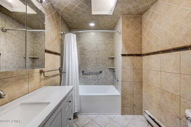 full bath with a baseboard radiator, tile walls, tile patterned floors, shower / bathtub combination with curtain, and vanity