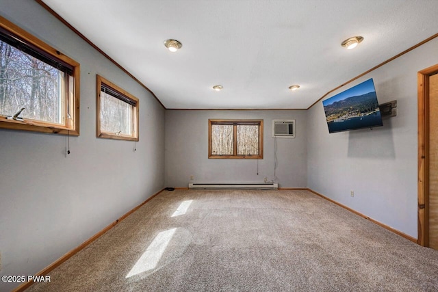 unfurnished room with baseboards, a wall mounted air conditioner, a baseboard heating unit, and carpet