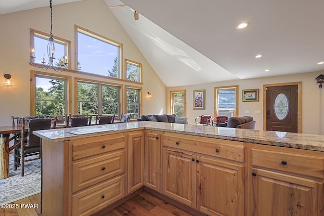 980 Long Ridge Rd, Hawley, PA 18428 - kitchen with recessed lighting, dark wood-style flooring, high vaulted ceiling, open floor plan, and a chandelier