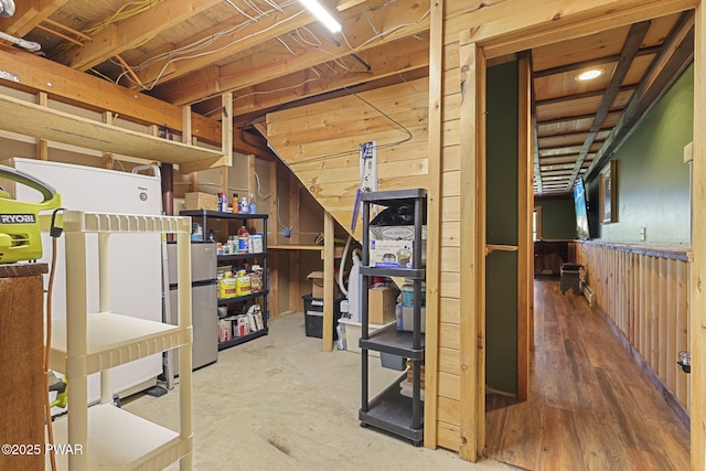 980 Long Ridge Rd, Hawley, PA 18428 - unfinished below grade area with wooden walls and freestanding refrigerator