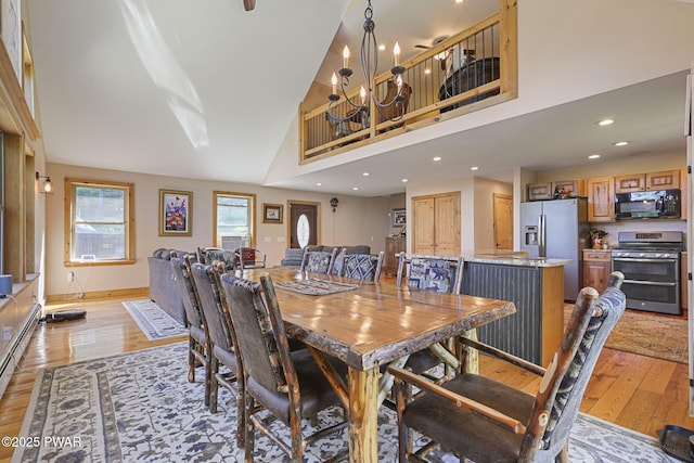 980 Long Ridge Rd, Hawley, PA 18428 - dining area featuring light wood-style floors, a chandelier, recessed lighting, and high vaulted ceiling