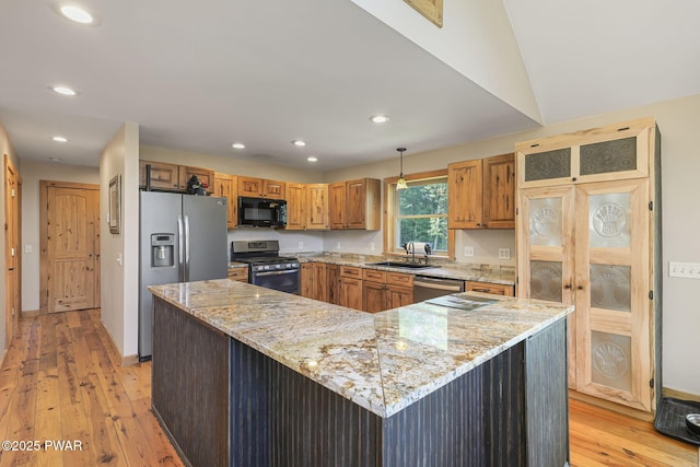 980 Long Ridge Rd, Hawley, PA 18428 - kitchen with stainless steel appliances, recessed lighting, light wood-style flooring, and light stone countertops