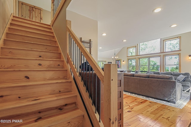 980 Long Ridge Rd, Hawley, PA 18428 - stairway featuring a chandelier, recessed lighting, and hardwood / wood-style floors