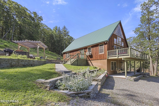 980 Long Ridge Rd, Hawley, PA 18428 - view of side of property featuring a pergola, board and batten siding, a patio area, a wooden deck, and a yard