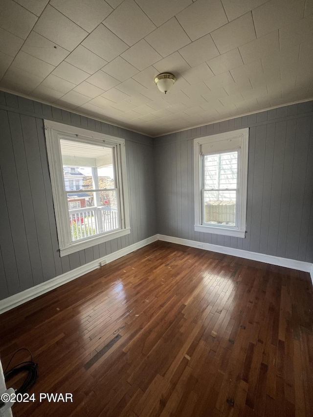 spare room with hardwood / wood-style flooring