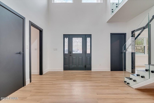 328 Forest Dr, Lords Valley, PA 18428 - entrance foyer featuring a high ceiling, light wood finished floors, and stairs