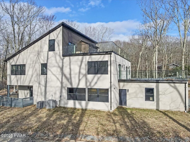 328 Forest Dr, Lords Valley, PA 18428 - rear view of house featuring a balcony and stucco siding