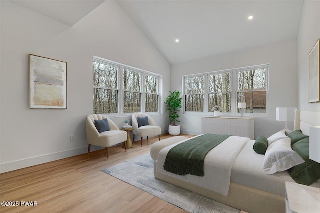 328 Forest Dr, Lords Valley, PA 18428 - bedroom featuring multiple windows, radiator heating unit, recessed lighting, high vaulted ceiling, and wood finished floors