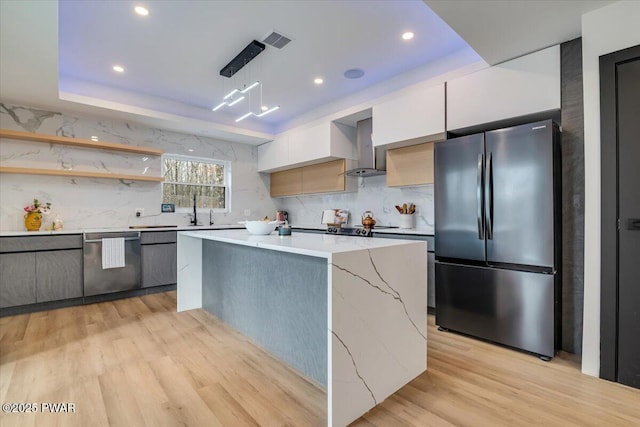 328 Forest Dr, Lords Valley, PA 18428 - kitchen with stainless steel appliances, modern cabinets, exhaust hood, a raised ceiling, and recessed lighting
