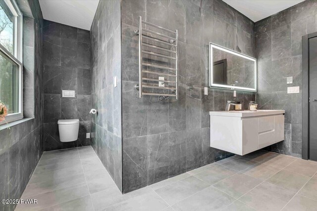 328 Forest Dr, Lords Valley, PA 18428 - bathroom with radiator, tile walls, vanity, and tile patterned flooring
