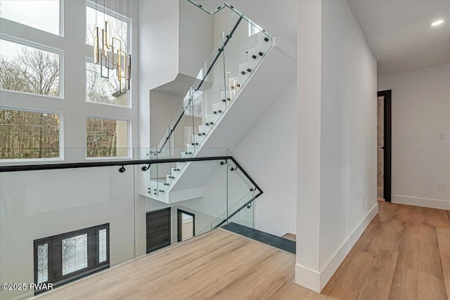 328 Forest Dr, Lords Valley, PA 18428 - stairs with a towering ceiling, wood finished floors, and recessed lighting