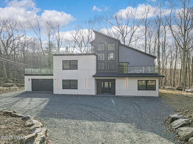 328 Forest Dr, Lords Valley, PA 18428 - view of front facade with gravel driveway and a garage