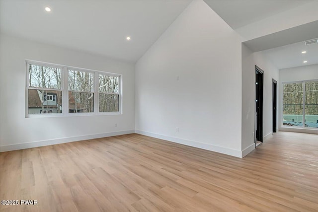 328 Forest Dr, Lords Valley, PA 18428 - empty room with light wood-style floors, vaulted ceiling, and recessed lighting