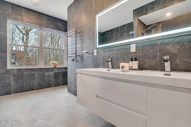 328 Forest Dr, Lords Valley, PA 18428 - full bath featuring tile walls, double vanity, tile patterned flooring, and a shower