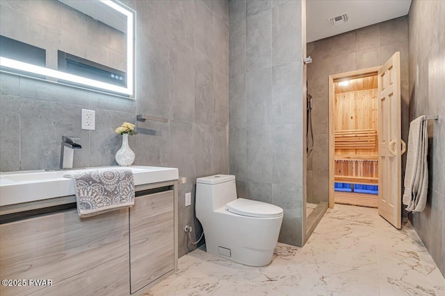 328 Forest Dr, Lords Valley, PA 18428 - bathroom with tile walls, a stall shower, marble finish flooring, and vanity