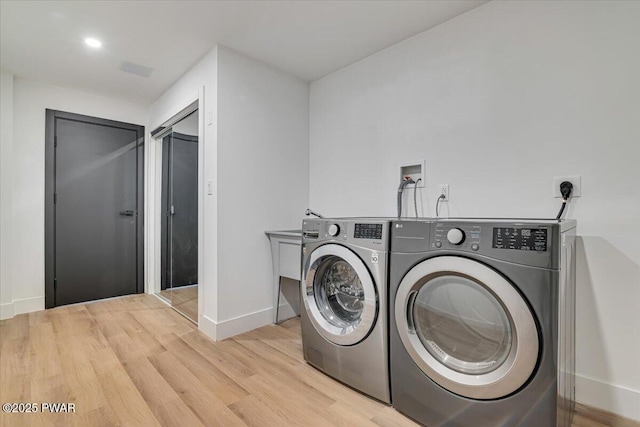 328 Forest Dr, Lords Valley, PA 18428 - washroom featuring independent washer and dryer and light wood-style floors