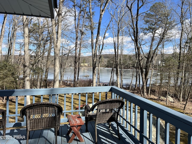 wooden terrace with a water view