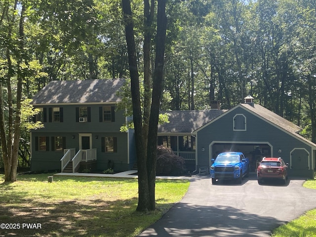 110 Stonefield Rd, Milford, PA 18337 - view of front of house with driveway, a garage, and a front lawn
