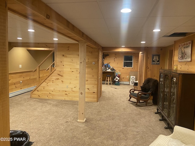110 Stonefield Rd, Milford, PA 18337 - finished basement with a baseboard heating unit, carpet floors, recessed lighting, wooden walls, and a paneled ceiling