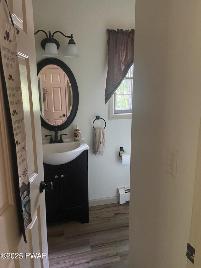 110 Stonefield Rd, Milford, PA 18337 - bathroom with a baseboard radiator, vanity, and wood finished floors