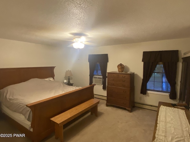 110 Stonefield Rd, Milford, PA 18337 - bedroom featuring a baseboard heating unit, a textured ceiling, a baseboard radiator, cooling unit, and light colored carpet